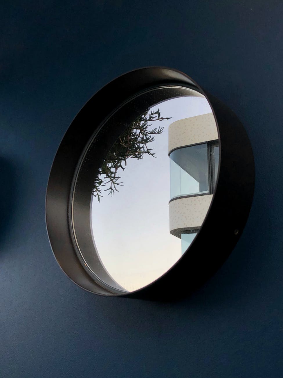 round mirror with black frame