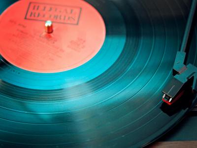 blue vinyl record playing on turntable