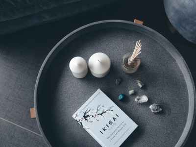 photo of candles stones and book