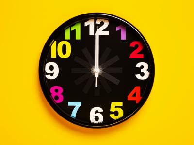 black and yellow analog clock
